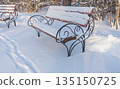 Winter. Benches are covered with heavy snow. A lot of snow. High quality photo 135150725