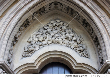 Oxford, United Kingdom - Dec 22, 2025: Wesley Memorial Church, a Methodist church in central Oxford. Tympanum above the entrance, decorated with stone carvings. Oxford, United Kingdom - Dec 22, 2025: Wesley Memorial Church, a Methodist church in central Oxford. Tympanum above the entrance, decorated with stone carvings. 135151108