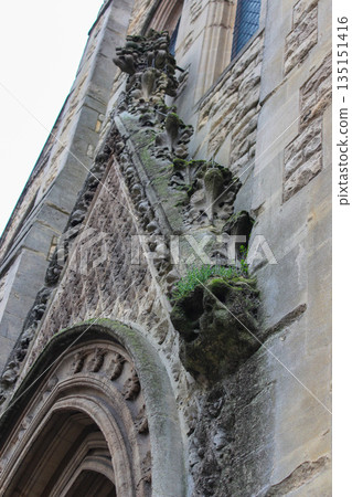 Oxford, United Kingdom - Dec 22, 2025: Wesley Memorial Church, a Methodist church in central Oxford. Tympanum above the entrance, decorated with stone carvings. Oxford, United Kingdom - Dec 22, 2025: Wesley Memorial Church, a Methodist church in central Oxford. Tympanum above the entrance, decorated with stone carvings. 135151416