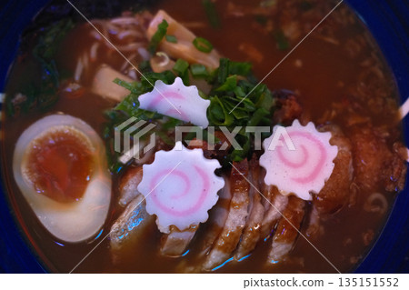 A delicious bowl of traditional Japanese ramen with pork, egg, noodles, and flavorful broth. A delicious bowl of traditional Japanese ramen with pork, egg, noodles, and flavorful broth. 135151552