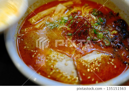 A delicious bowl of traditional Japanese ramen with pork, egg, noodles, and flavorful broth. A delicious bowl of traditional Japanese ramen with pork, egg, noodles, and flavorful broth. 135151563
