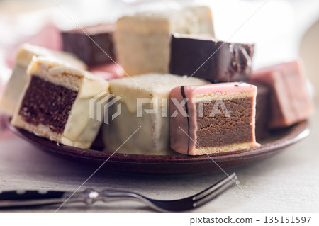 Sweet dessert cake. Mini pie on plate on kitchen table. Sweet dessert cake. Mini pie on plate on kitchen table. 135151597