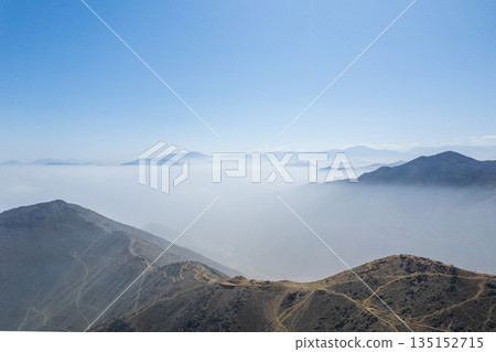 The sky is clear and blue with a few clouds The sky is clear and blue with a few clouds 135152715