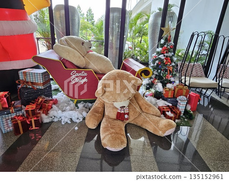 this is bear toy decoration with chrismas tree background this is bear toy decoration with chrismas tree background 135152961