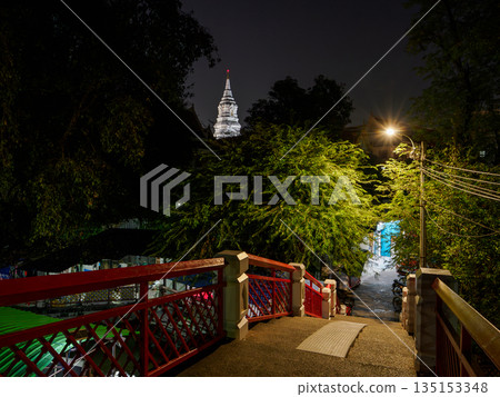 Wat Paknam Phasi Charoen seen from the city at night, Bangkok, Thailand Wat Paknam Phasi Charoen seen from the city at night, Bangkok, Thailand 135153348
