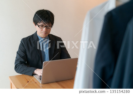 Men working in the apparel industry Men working in the apparel industry 135154280