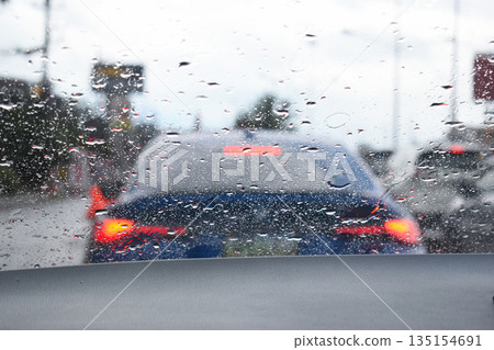 car on highway road with rainny season, blurred image 135154691