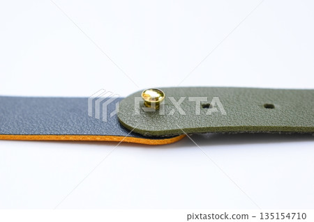 dark blue and green leather strap isolated on white background 135154710