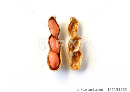Cracked peanuts on a white background, viewed from directly above Cracked peanuts on a white background, viewed from directly above 135155263