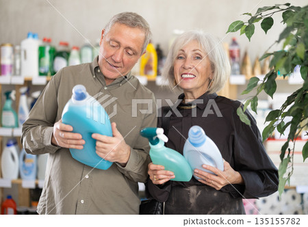 Elderly couple opting for cleaning spray and detergent Elderly couple opting for cleaning spray and detergent 135155782