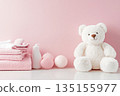 Baby bath accessories, bottles of shampoo with teddy bear and pink towels 135155977