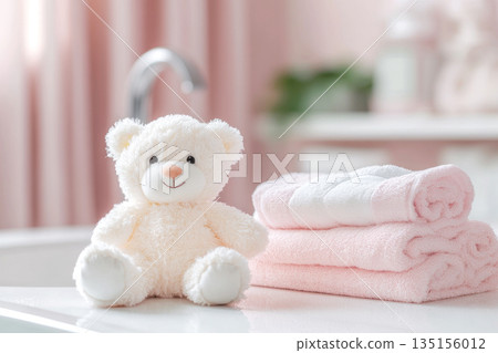 Baby bath accessories, bottles of shampoo with teddy bear and pink towels 135156012