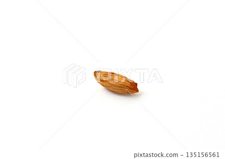 Small peanuts on a white background 135156561