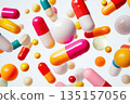 A vibrant array of capsules and pills floating against on white background, healthy concept 135157056