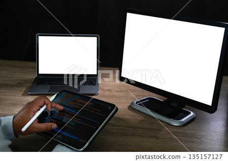 work from home office workspace with mock-up laptop with white blank screen working on laptop computer at home office work from home office workspace with mock-up laptop with white blank screen working on laptop computer at home office 135157127