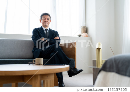 Senior businessman with his arms crossed and looking confident Senior businessman with his arms crossed and looking confident 135157305