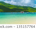 landscape with beach and blue water in bay of sea on a tropical paradise island in summer 135157764