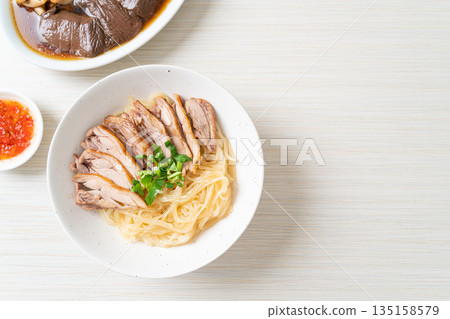 dried noodles with stewed duck in white bowl dried noodles with stewed duck in white bowl 135158579