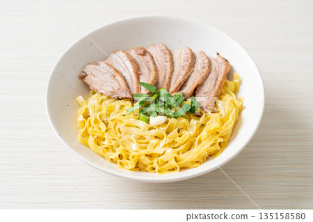 dried duck noodles in white bowl 135158580