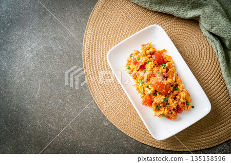 Stir-fried tomatoes with egg or Scrambled eggs with tomatoes 135158596