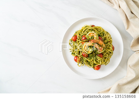 Spaghetti with prawns or shrimps in homemade pesto sauce Spaghetti with prawns or shrimps in homemade pesto sauce 135158608