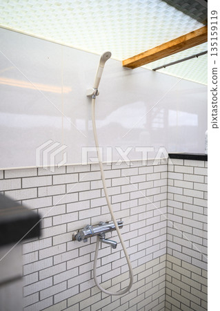 Shower facilities with white tile walls (Photography cooperation: Oki Seaside Resort Miyabi) 135159119