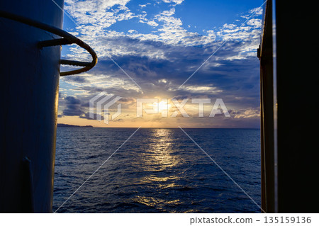 Sunset sea seen from a boat Sunset sea seen from a boat 135159136