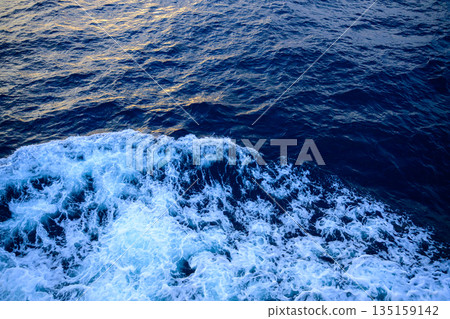 Sea foam made by a ship Sea foam made by a ship 135159142
