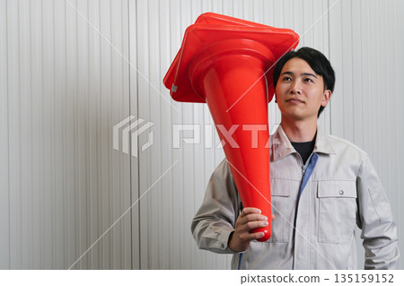 Young man wearing work clothes Construction image Young man wearing work clothes Construction image 135159152