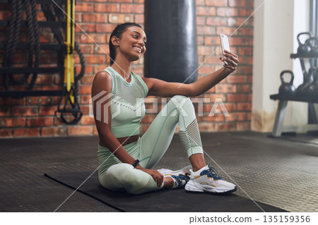 Gym, fitness or happy woman taking selfie on workout, exercise or training break for social media. Wellness, smile or healthy Indian girl smiling, relaxing or taking pictures for online post 135159356