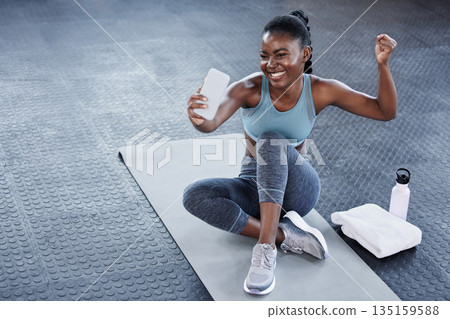 Gym, flexing or happy black woman taking selfie on workout, exercise or training break on social media. Wellness, smile or healthy African girl relaxing or taking pictures for online fitness content 135159588