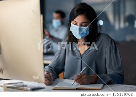Call center, woman and notes at computer with mask for customer service, sales consulting and CRM in office. Female agent, consultant and virus protection in telemarketing agency for administration Call center, woman and notes at computer with mask for customer service, sales consulting and CRM in office. Female agent, consultant and virus protection in telemarketing agency for administration 135159708