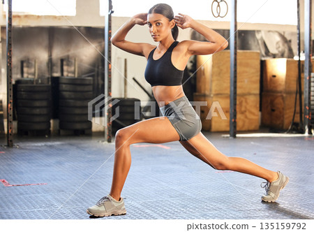 Portrait, lunges or Indian woman at gym training, exercise or body workout for balance or strong muscles. Stretching, resilience or healthy girl athlete exercising for powerful legs in fitness club 135159792