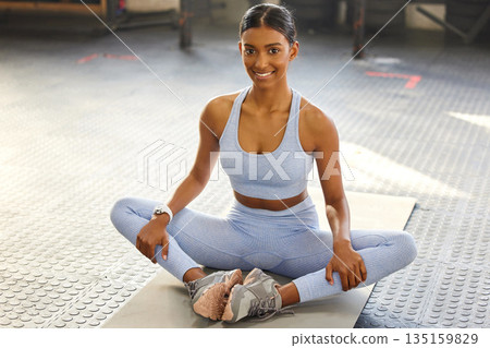 Meditation, yoga and portrait of Indian woman in gym for wellness, mindfulness and breathing exercise on floor. Health, meditate and female person in lotus pose for calm, zen and balance in training 135159829
