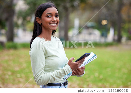Campus, smartphone and happy woman or student portrait for university or feedback and school results outdoors. College, mobile and young girl for scholarship application or smile or study information Campus, smartphone and happy woman or student portrait for university or feedback and school results outdoors. College, mobile and young girl for scholarship application or smile or study information 135160038