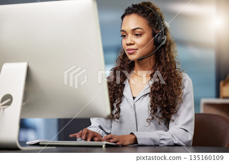 Call center, virtual assistant or woman typing on computer at telecom customer services office job help desk. Microphone, technology or female sales agent consulting or helping in tech support on pc 135160109