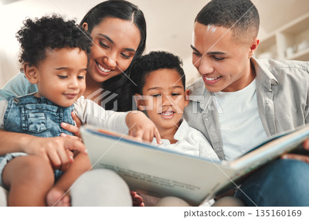 Young happy family, children reading and couch for story, book and learning together in home, love and bonding. Parents, education and kids on living room sofa with smile, care and support in house 135160169