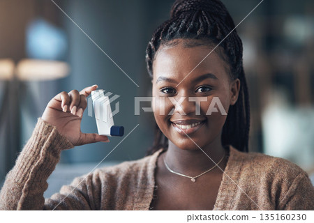 Asthma, medicine and portrait of a woman with inhaler to breathe in home for health and wellness. Happy black person with pharmaceutical product for healthcare, lungs or chest and respiratory problem Asthma, medicine and portrait of a woman with inhaler to breathe in home for health and wellness. Happy black person with pharmaceutical product for healthcare, lungs or chest and respiratory problem 135160230