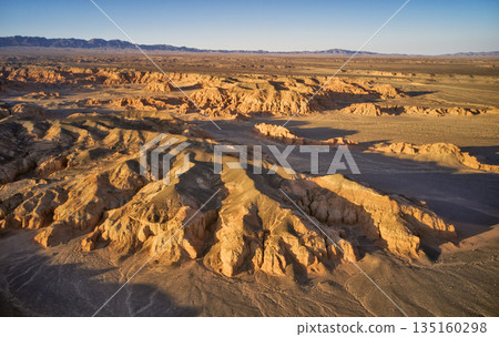 Breathtaking Aerial View of a Stunning Desert Landscape at Golden Hour 135160298