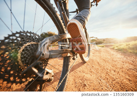 Summer, cycling and a man on a bike and dirt road for fitness, morning cardio or adventure in nature. Sports, feet and a person on a bicycle for a race, competition or exercise in the countryside Summer, cycling and a man on a bike and dirt road for fitness, morning cardio or adventure in nature. Sports, feet and a person on a bicycle for a race, competition or exercise in the countryside 135160309