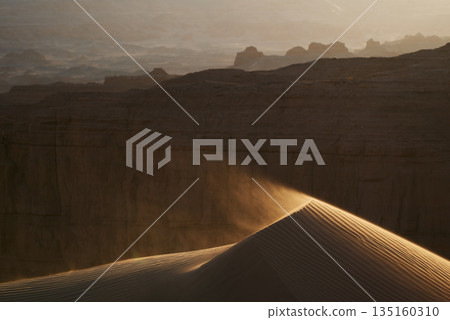 Golden Sands offers a stunning sunset view of majestic desert dunes Golden Sands offers a stunning sunset view of majestic desert dunes 135160310