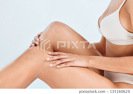 Woman, hand and legs epilation of wellness, cosmetic wax and skincare treatment in studio. White background, female person model and natural beauty with body care and smooth leg shave in underwear Woman, hand and legs epilation of wellness, cosmetic wax and skincare treatment in studio. White background, female person model and natural beauty with body care and smooth leg shave in underwear 135160629