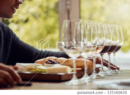 Wine tasting, cheese platter and luxury restaurant with alcohol and glass for customer. Eating, drink and sommelier with bottle for wines and food pairing in a fine dining and winery experience Wine tasting, cheese platter and luxury restaurant with alcohol and glass for customer. Eating, drink and sommelier with bottle for wines and food pairing in a fine dining and winery experience 135160630