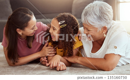 Smile, generations and relax with family on floor of living room for bonding, care and love. Happiness, trust and grandmother with young child and excited mom at home for play, support and together 135160730