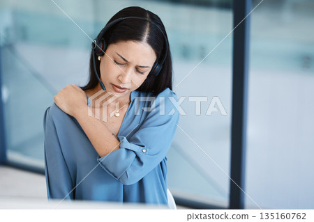 Call center, tired agent or woman with shoulder pain and headset in telemarketing, sales or crm office. Frustrated customer care consultant person back ache problem, burnout and posture or stress 135160762