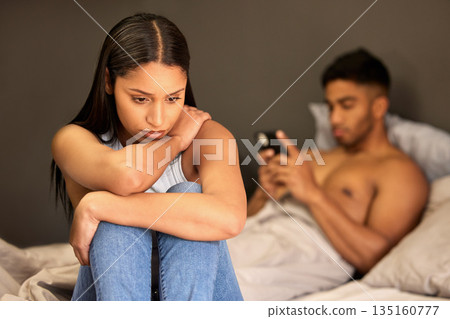 Sad woman, couple fight and man typing with digital affair, relationship problem and depressed in bed. Breakup, divorce talk and cheating with female person feeling stress and guilty in home bedroom 135160777