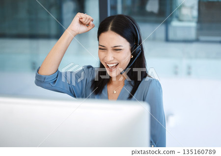 Happy woman, call center and fist in celebration for promotion, success or winning bonus at office. Excited female person, consultant or agent in joy for win, victory or customer service at workplace 135160789