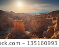 Small silhouette of photographer in desert landscape with rock formations canyon 135160993