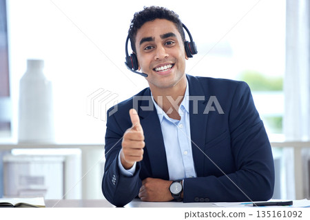 Portrait, thumbs up and business man in call center office for support, trust and success. Face, like hand gesture and happy person with excellence emoji, welcome and thank you for customer service. 135161092