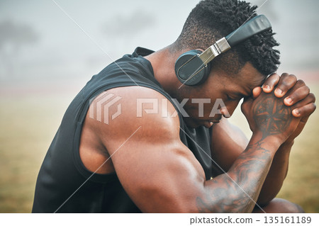 Music, training and thinking with black man in park for exercise, strong and motivation. Streaming, sports podcast and radio with male athlete and headphones for muscle, workout and challenge Music, training and thinking with black man in park for exercise, strong and motivation. Streaming, sports podcast and radio with male athlete and headphones for muscle, workout and challenge 135161189